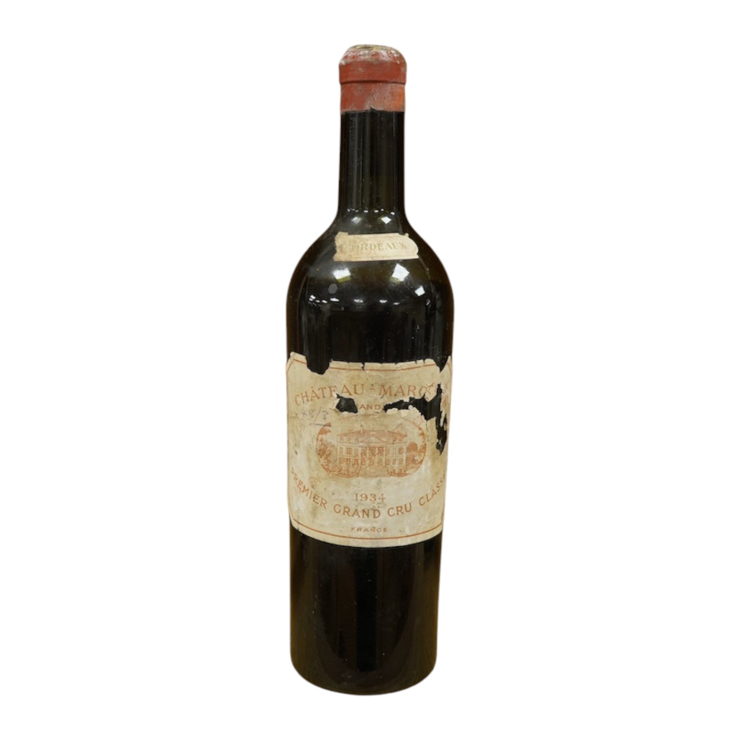 A bottle of Chateau Margaux 1934 Premier Grand Cru, Bordeaux, red wine. Condition - poor, level low and labels damaged, storage history unknown.